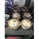 20th cent. Ceramics: Carter, Stabler Adams preserve pots with floral decoration. Six pots, 4 lids (2