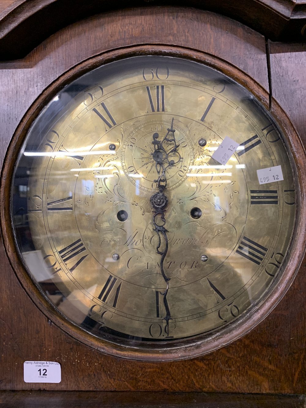 Clocks: Early 19th cent. Oak eight day longcase. Circular brass dial. Thomas Edwards of Castor. Dial