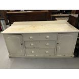 19th cent. Pine white painted dresser base, three central drawers flanked by single door