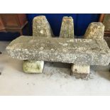 Stonework: Limestone garden seat, resting on two block supports. The seat measures 53ins. x 7ins.