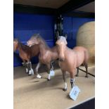 Beswick & Royal Doulton: Two Bay Race Horses, standing and a Prancing Horse, matt finish.