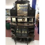 20th cent. Mahogany ornate display cupboard, mirror backed top with single shelf, carved and
