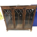 20th cent. Three door glazed bookcase, Gothic arch mouldings, on cab supports. 46½ins. x 46ins. x