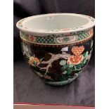 Circa. 1900. Chinese Famille Noir fish bowl, the exterior decorated with flowers and birds to the