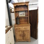 20th cent. Pine two door dresser with one drawer and two shelves. 77ins. x 32ins. x 19ins.