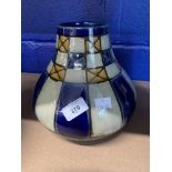 Doulton: Lambeth bulbous short neck vase decorated in blue, cream and brown panels. The neck