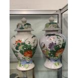 Oriental Ware: Baluster jars with covers, painted with exotic birds and flowers. A pair. 19ins.