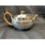 Silver: George III part lobed teapot with fruitwood handle, Rebecca Eames London 1812. 17.5oz.