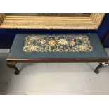 20th cent. Mahogany woolwork footstool with embroidered floral cover on cabriole supports. 39ins.