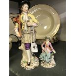 19th cent. Continental figurines of a male with a basket and walking stick (a/f). 9¾ins. Plus a