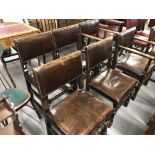 Set of 6 pre-war oak dining chairs with brown leather seats and backs, 4 chairs plus 2 carvers. Plus