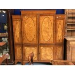 Early 19th cent. Regency mahogany compactum, with satinwood and yew veneered panels to the doors.