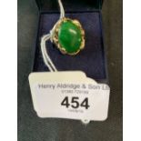 The Lady Lowry Jewellery Collection: Jade jewellery. Oval cabouchon ring set in 18ct gold (