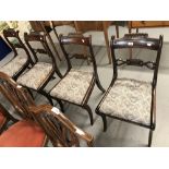19th cent. Rosewood sabre leg dining chairs with drop in seats. (4)
