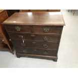 18th cent. Mahogany chest of drawers on bracket supports, two over three drawers with brass