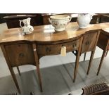 Georgian mahogany bow fronted sideboard with one central drawer flanked by two cupboards. All with