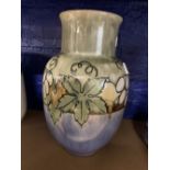 Royal Doulton: Lambeth bulbous vase, decorated with a band of vine leaves and grapes. Lower half