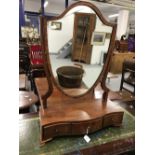 19th cent. Mahogany dressing table mirror with shield shaped frame and a three drawer serpentine