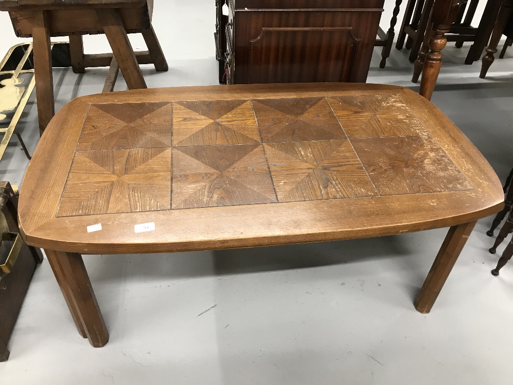 Mid 20th cent. G plan oak coffee table with tile effect top. 44ins. x 25½ins. x 17ins.