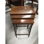 20th cent. Mahogany best of three tables of modest proportions.