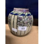 Royal Doulton: Lambeth art deco stone ware vase with floral motifs, crafted by Florrie Jones. This