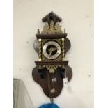 Clocks: 20th cent. Striking wall clock operated by weights and pendulum.