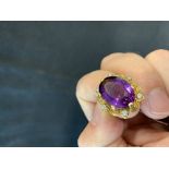 The Lady Lowry Jewellery Collection: Diamond jewellery. Oval cut amethyst surrounded by six small