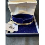 Hallmarked Gold: Hollow bangle 9ct. maker A Ltd. plus a receipt for £115 from Gold Smiths