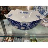 Chinese Porcelain: Bowl of square form, decorated in underglaze and blue with panels of figures in a