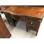 Late 19th/early 20th cent. Mahogany bow fronted desk/dressing table with fruitwood inlay. Seven