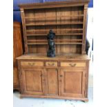 19th cent. Eastern European pine dresser with open pate rack. 61ins. x 22ins. x 84ins.