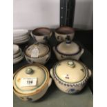 20th cent. Ceramics: Carter, Stabler Adams preserve pots with floral decoration. Six pots, 4 lids (2