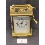 Clocks: Late 19th/early 20th cent. Brass carriage clock. White enamel face with Roman numerals,