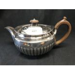 Silver: George III part lobed teapot with fruitwood handle, Rebecca Eames London 1812. 17.5oz.