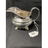 Silver: Georgian milk jug with shell, leaf and gadroon decoration. Date 1816, hallmarked London. 4.