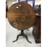 19th cent. Oak tilt top table on single turned support with tripod feet. Diameter 28ins.