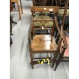 Early 20th cent. Oak child's high chair with crossed back rail and inlaid decoration.