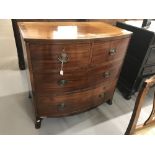 19th cent. Mahogany two over two, bow fronted chest of drawers, with boxwood inlay on bracket