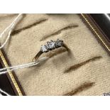 Jewellery: Yellow and white metal graduated three stone diamond ring, estimate weight of (3)