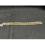 Jewellery: Yellow metal hollow double curb link bracelet. Stamped 585 (Tests as 14ct gold). Width