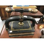 Late 18th/early 19th cent. Iron and brass book press. Brass and iron handle, vertical screw and