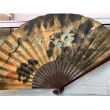 20th cent. Chinese decorative fan, bamboo, paper. Blade length 26ins. Label states Fujian. Made in