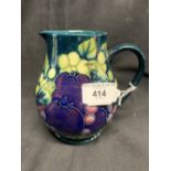 Moorcroft c1987. Finches and fruit jug, initials William Moorcroft to base. Height 5½ins. Star crack