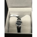 Watches: Gucci "G" watch, stainless steel black dial, strap watch with original box.