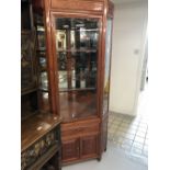20th cent. Chinese hardwood furniture. Corner display cabinet, carved decoration, glazed upper