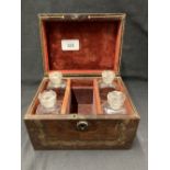 19th cent. Tooled leather perfume box, six divisions with four bottles and stoppers with red