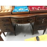 Late 19th/early 20th cent. Mahogany bow fronted desk/dressing table with fruitwood inlay. Seven