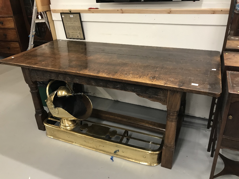 20th cent. Three plank oak refectory table, on turned supports with stretchers. 74ins. x 32ins.