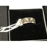 Hallmarked Gold: White gold 9ct fancy 7.5mm band, hallmarked Birmingham 1992. Weight 4g.