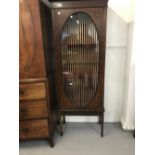 Late 19th/early 20th cent. Mahogany display cabinet with oval glazing to door. 27ins. x 69ins.